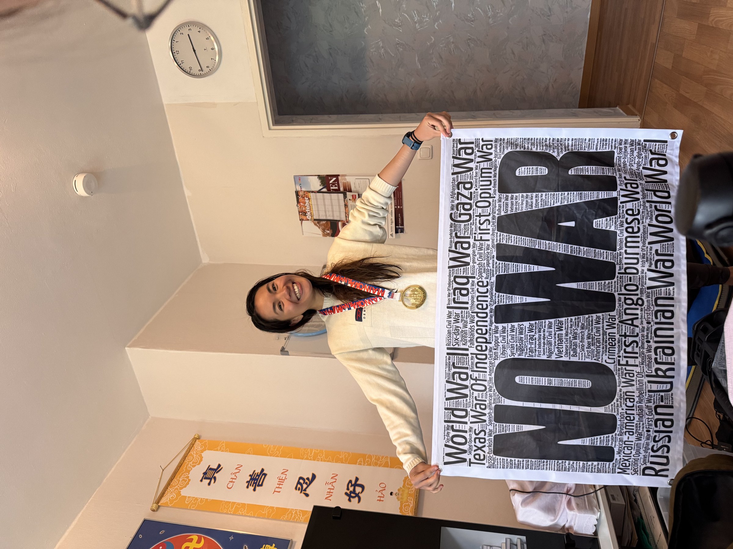 Hong with the “NO WAR” flag in Frankfurt