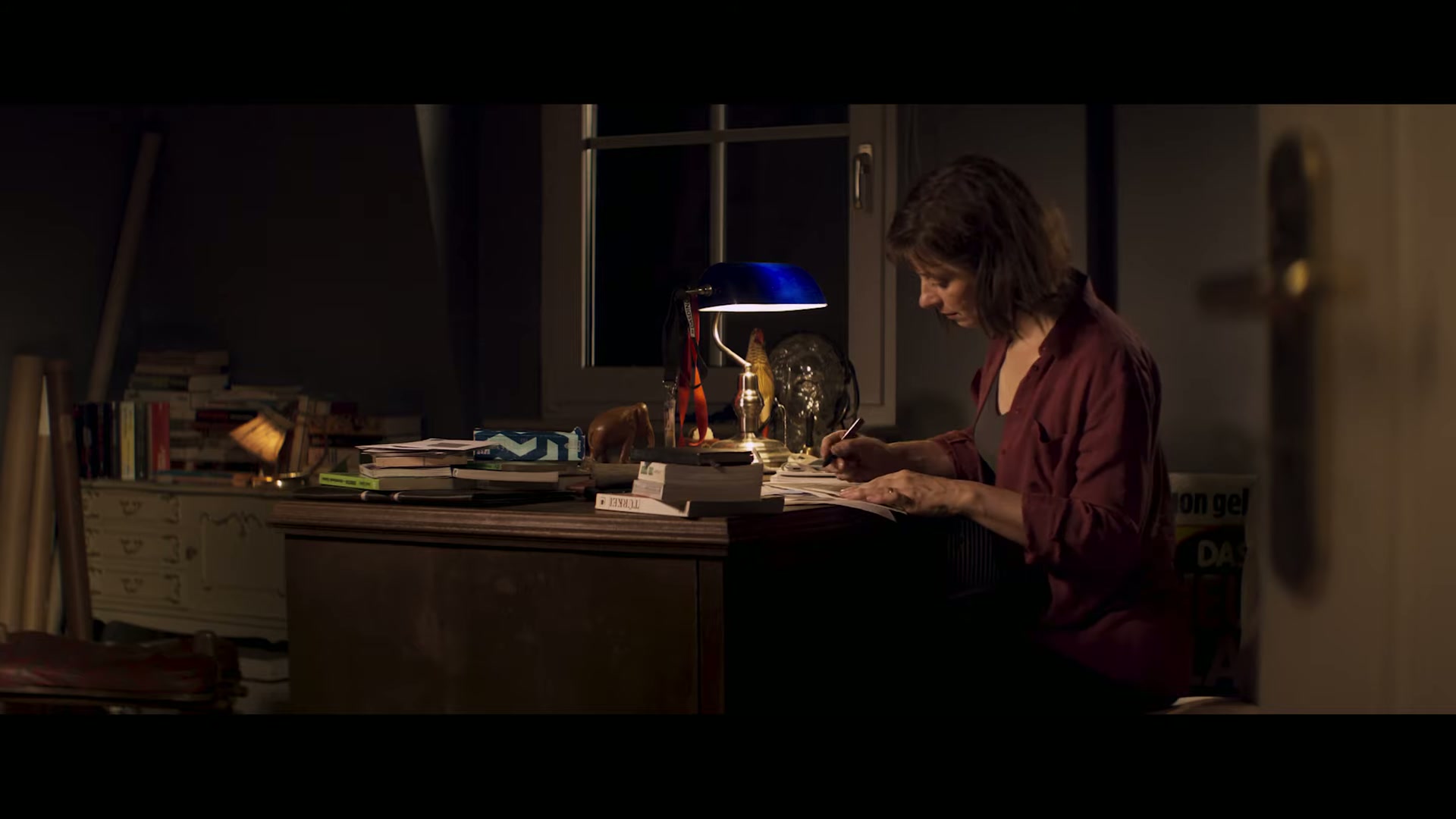 Anja at her desk in the home office before leaving on assignment