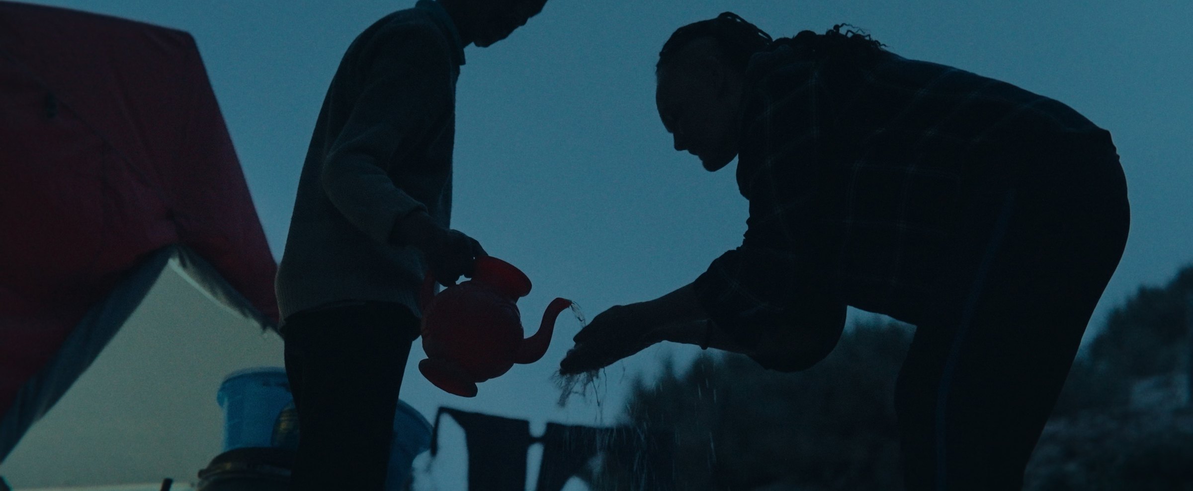 Silhouettes at the night camp